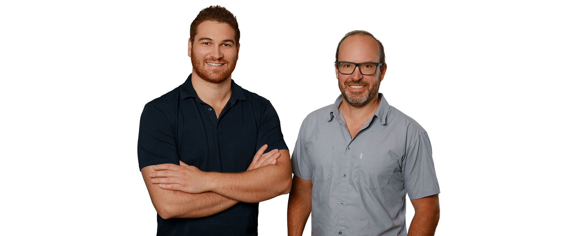 Two male dentists standing side by side in front of a vibrant green background.